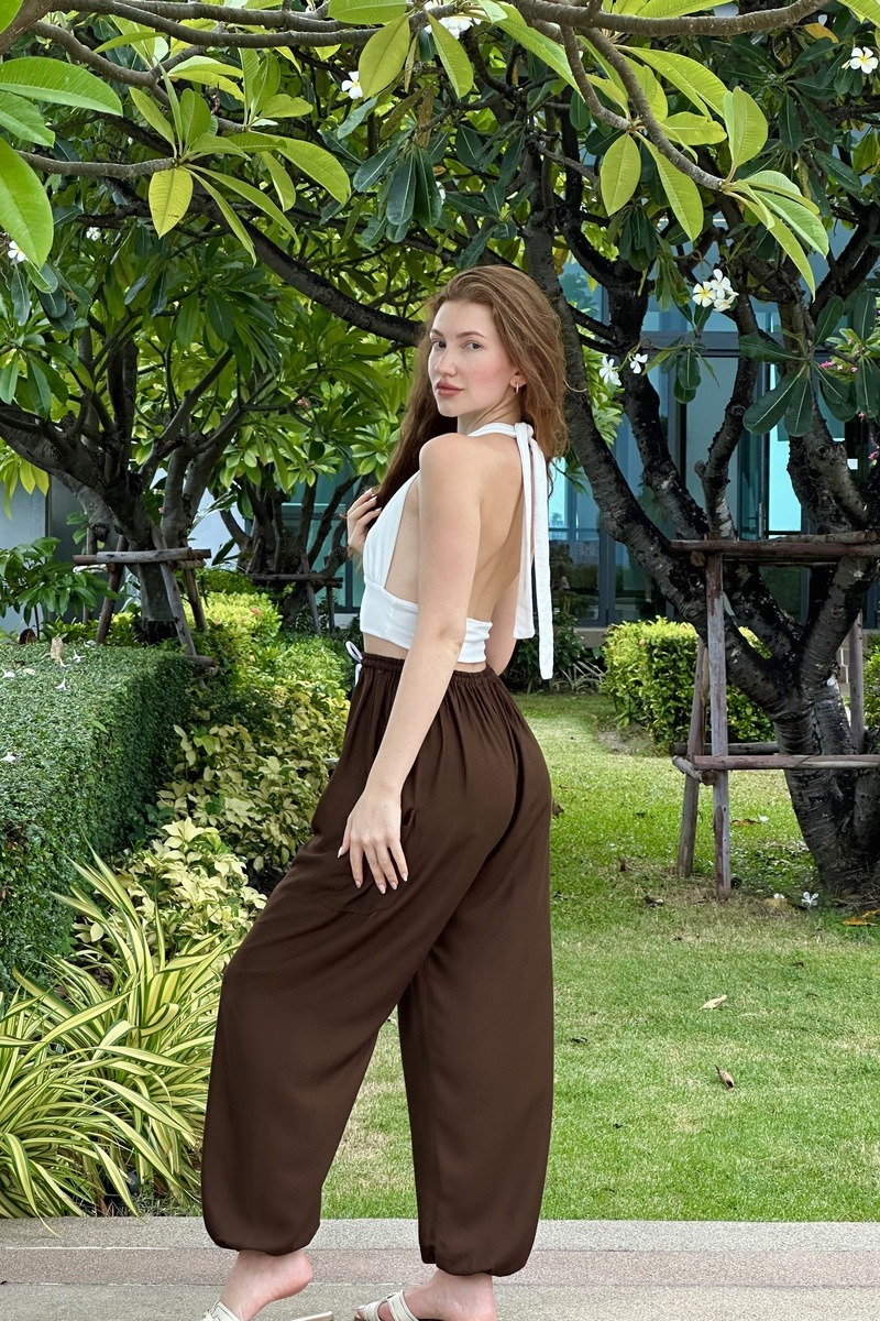 Relaxed pants in a garden